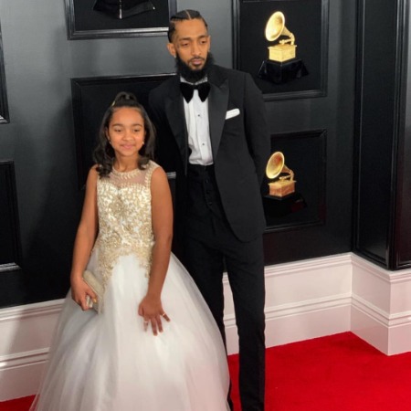 Emani Asghedom with her late father Nipsey Hussle.